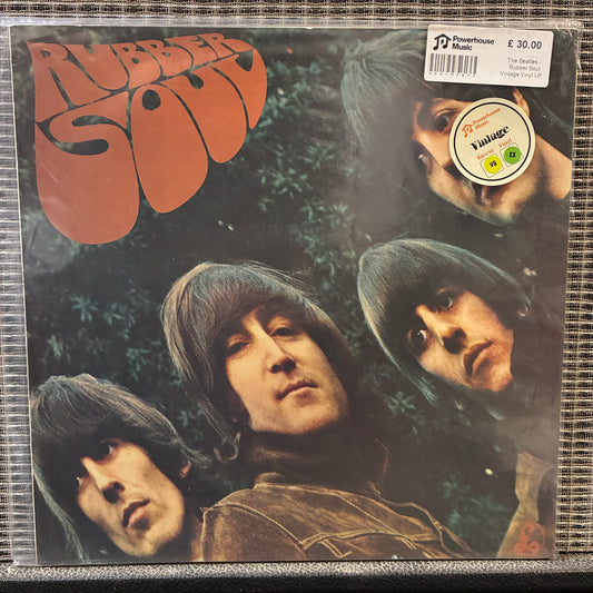 The Beatles - Rubber Soul Vinyl record cover for 'Rubber Soul' with band members' faces and album title.