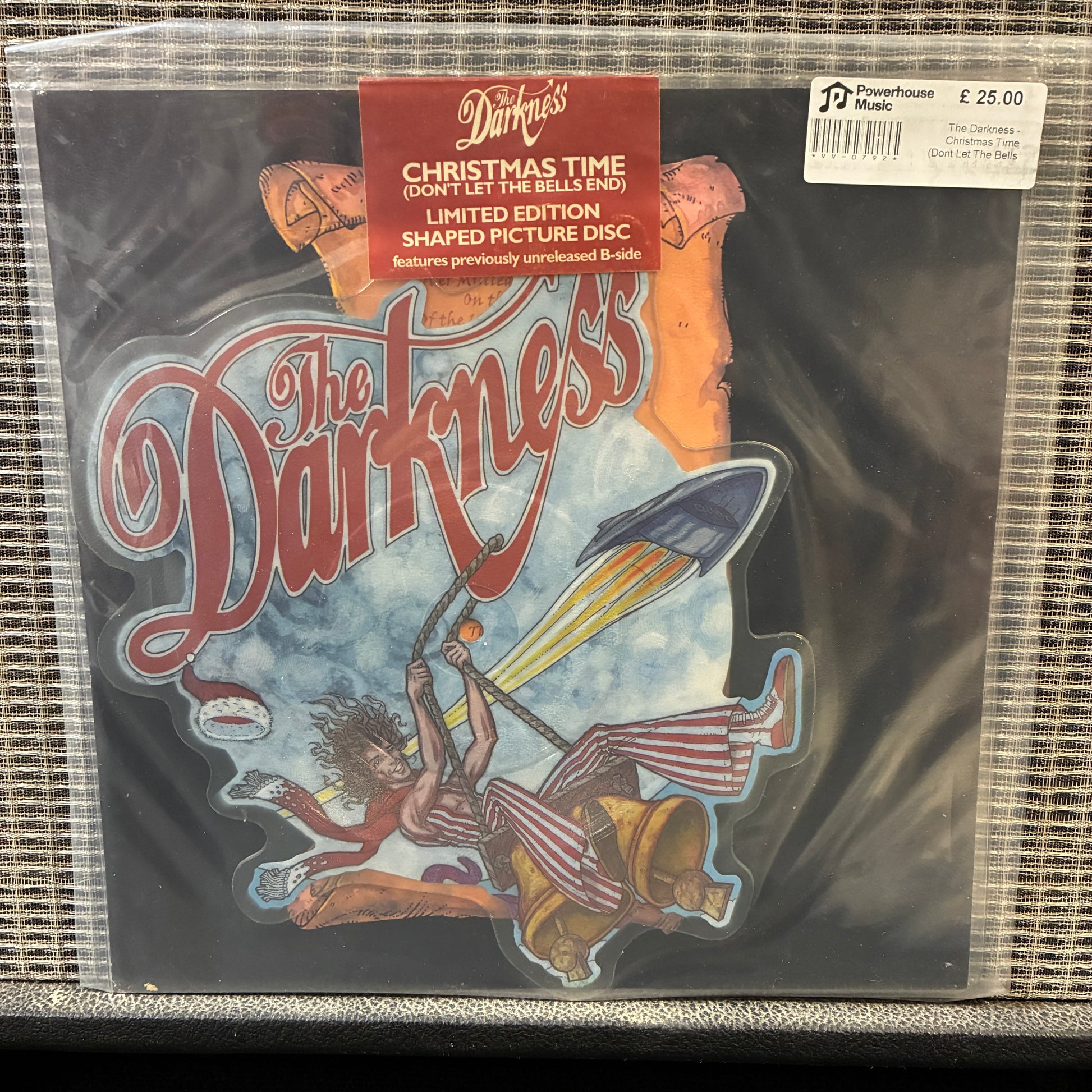 The Darkness - Christmas Time Vinyl record with 'The Darkness' album cover featuring a rocket and colorful design.