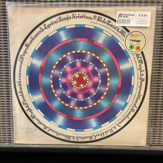 Curved Air - Airconditioning Vinyl record with a colorful spiral design on a beige background