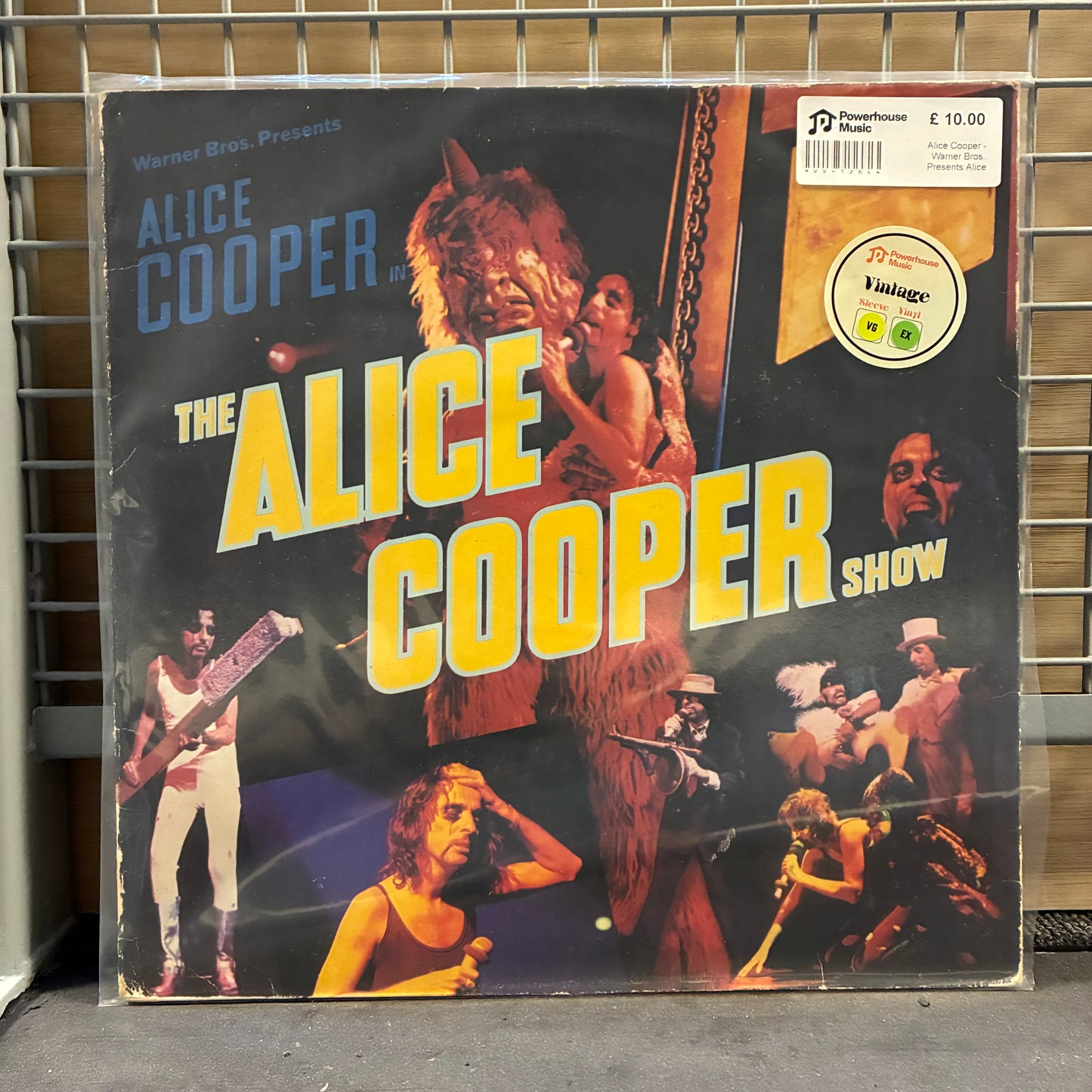 Alice Cooper Vinyl record cover for 'The Alice Cooper Show' on a metal rack.