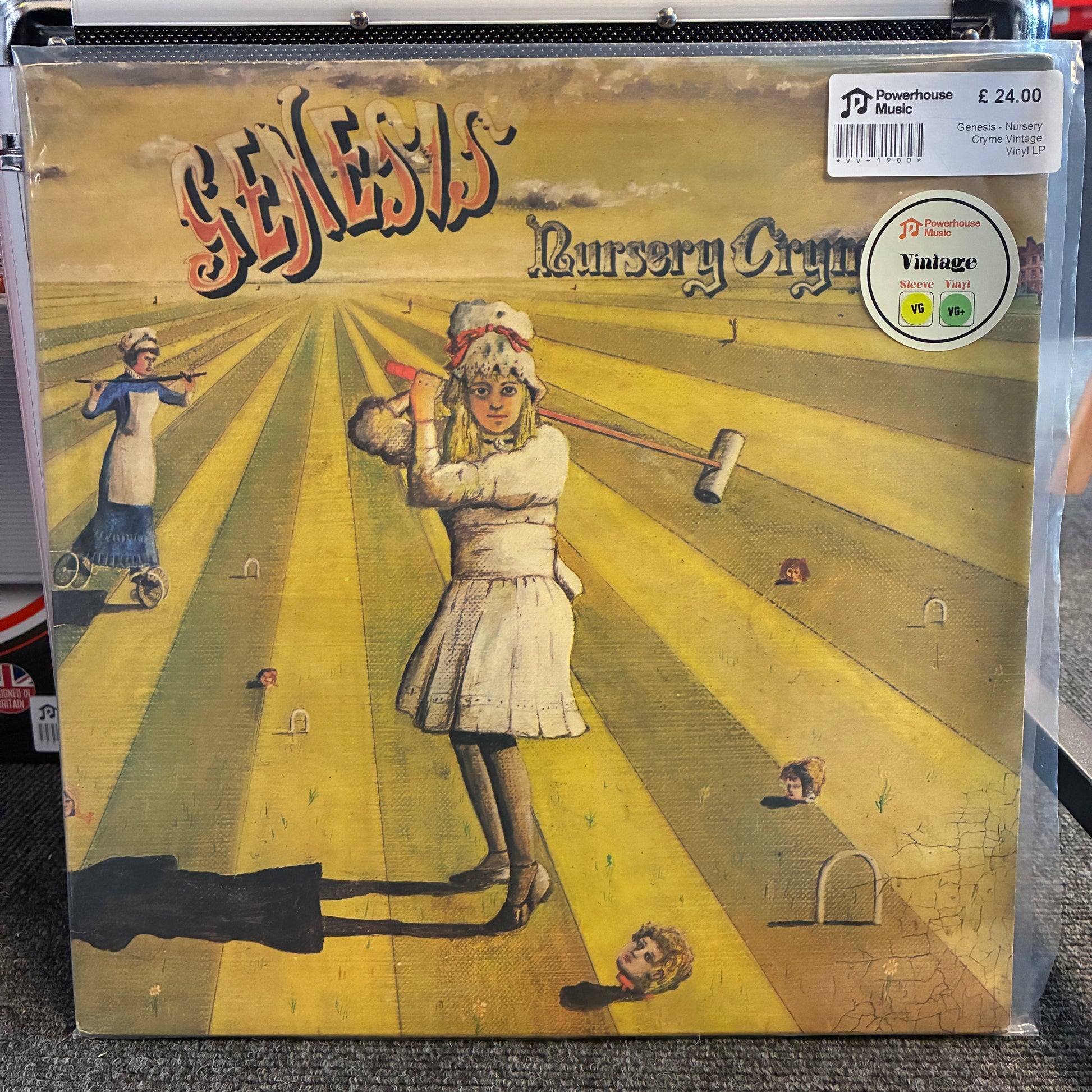 Genesis - Nursery Cryme Vintage Vinyl LP Genesis 'Bursary Cry' vinyl record album cover, sealed in a clear plastic protective sleeve. The cover art depicts a girl playing croquet in a yellow-striped field, with the band name 'Genesis' in stylized red and black lettering at the top.