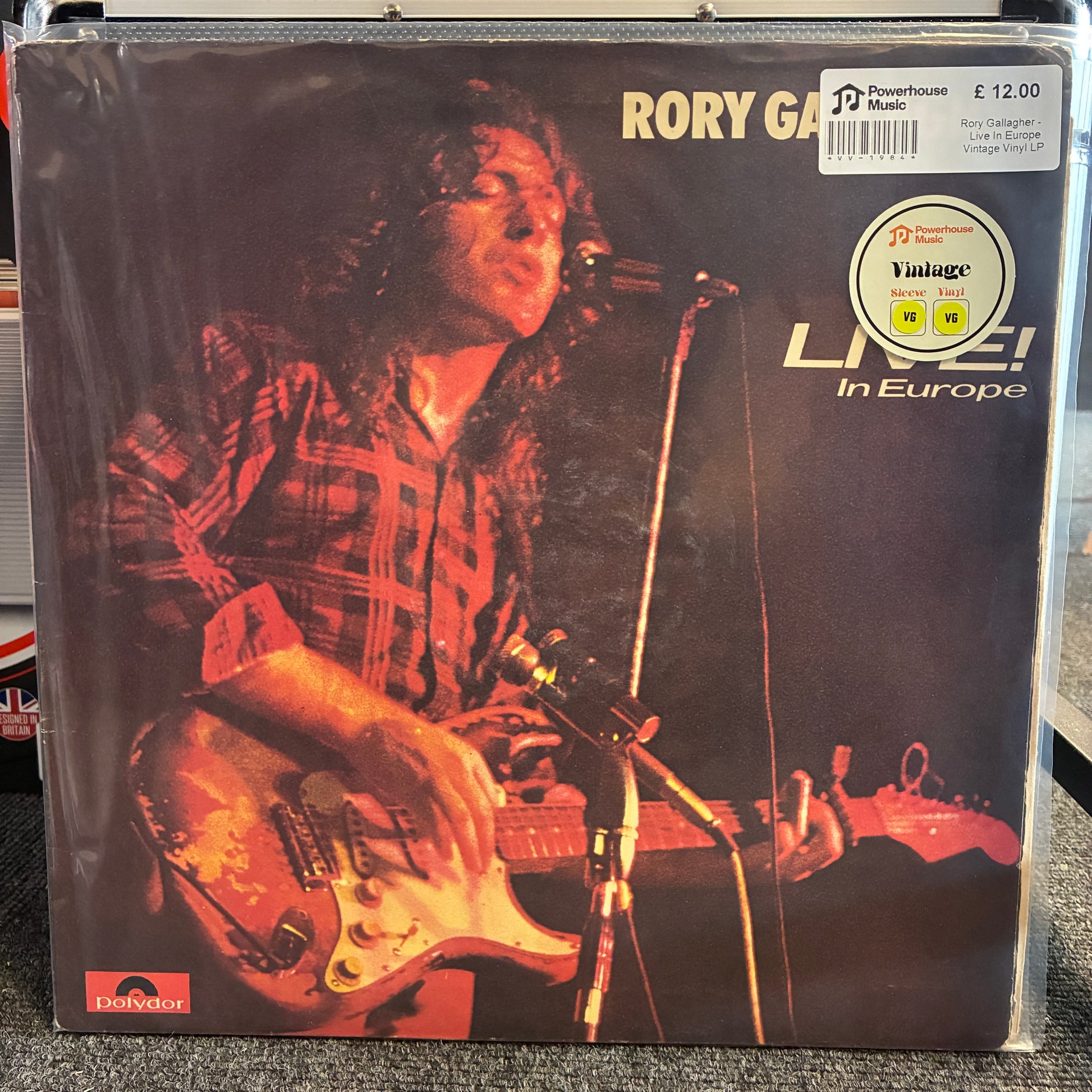 Rory Gallagher - Live In Europe Vintage Vinyl LP Rory Gallagher 'Live! In Europe' vinyl record album in its original shrink wrap, featuring a dark cover with a photo of Gallagher playing guitar and singing into a microphone.