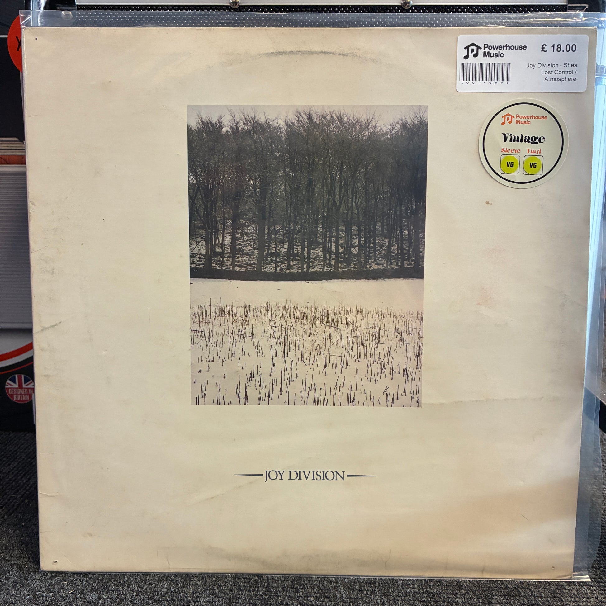 Joy Division - Shes Lost Control / Atmosphere Vintage Vinyl 12" Single Vintage Joy Division 'Parachute' vinyl record sleeve in cream-colored paper, featuring a black and white forest photograph. Includes a 'Vintage' sticker and a 'JD Music' barcode sticker.