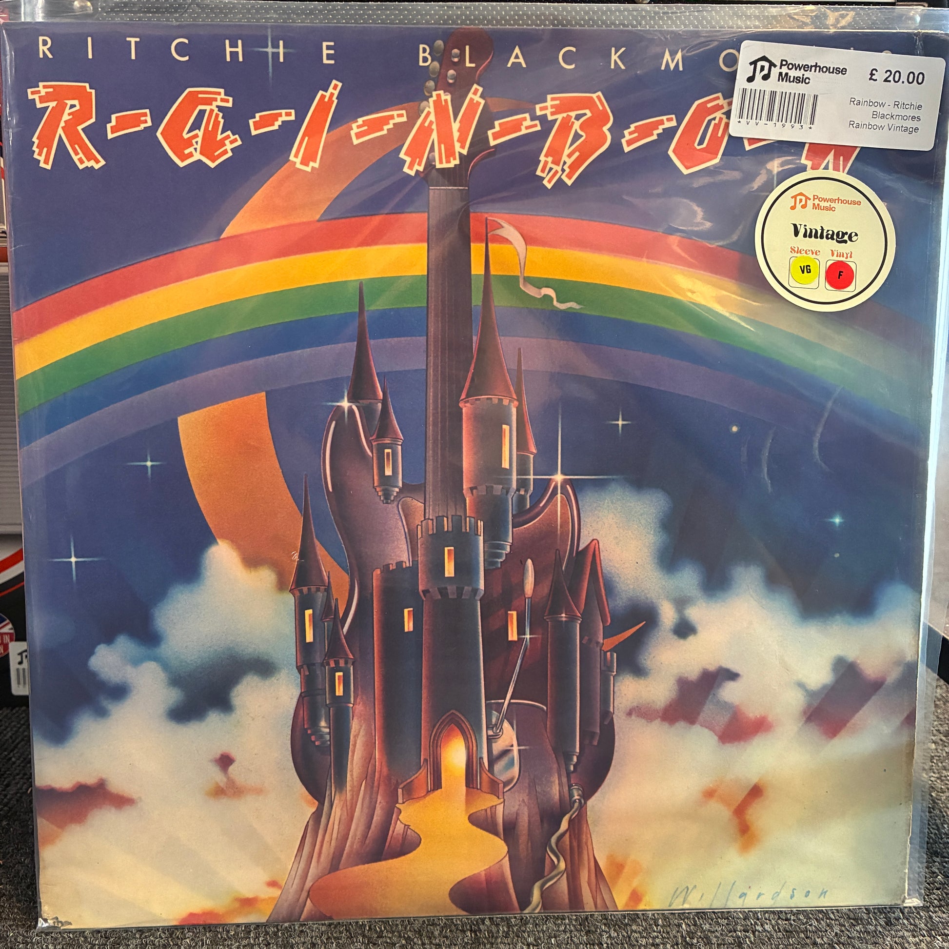 Rainbow - Ritchie Blackmores Rainbow Vintage Vinyl LP Ritchie Blackmore's Rainbow album cover on a vinyl record, showing a fantasy castle under a rainbow in a blue sky. A Powerhouse Music Vintage label sticker is visible in the top right corner.