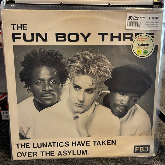 The Fun Boy Three - The Lunatics Have Taken Over The Asylum Vintage Vinyl 12" Single Vinyl record sleeve for The Fun Boy Three's 'The Lunatics Have Taken Over The Asylum' on Powerhouse Records, sealed in a clear plastic case. The cover features a black-and-white portrait of the three band members with bold black text on a cream background, and a Vintage 1970s sticker on the top right.