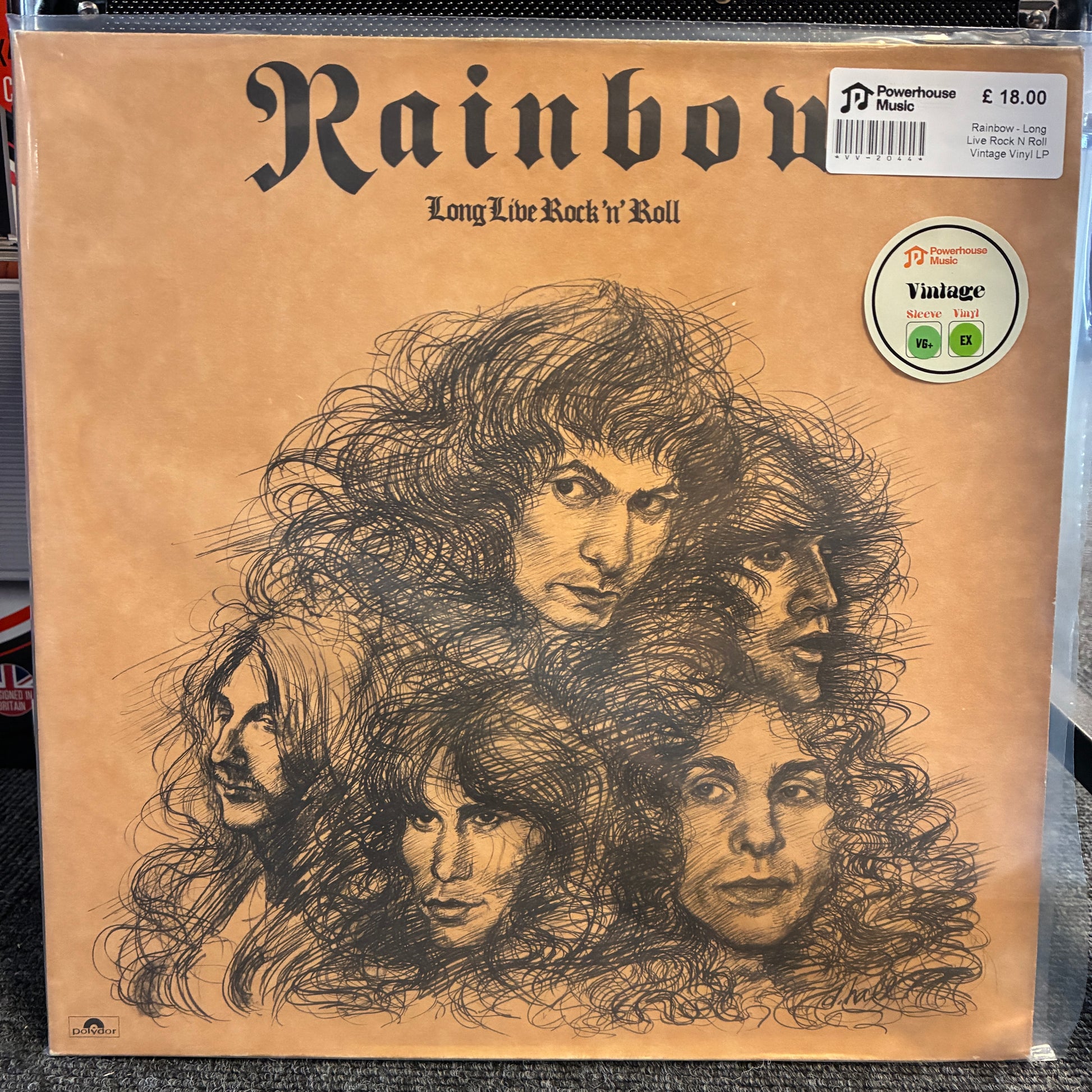Rainbow - Long Live Rock N Roll Vintage Vinyl LP A vintage Rainbow band vinyl record sleeve, 'Long Live Rock 'n' Roll', in its original shrink wrap. The cover is tan with black sketch-style portraits of the band members and features a white 'Pioneer Vintage' sticker on the top right.