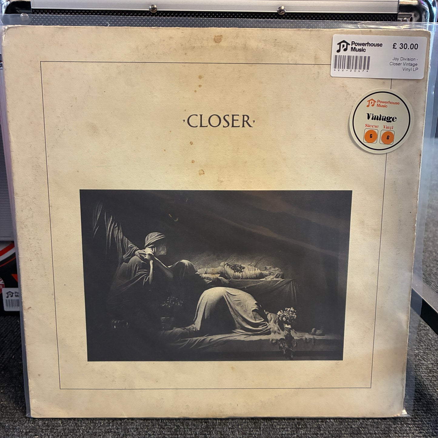 Joy Division - Closer Vintage Vinyl LP A vintage vinyl record sleeve for Jay DeMarcus's album 'Closer', showing a sepia-toned cover with a dark classical painting of a reclining woman and a man playing a flute. A Powerhouse Records sticker is visible in the top right corner.