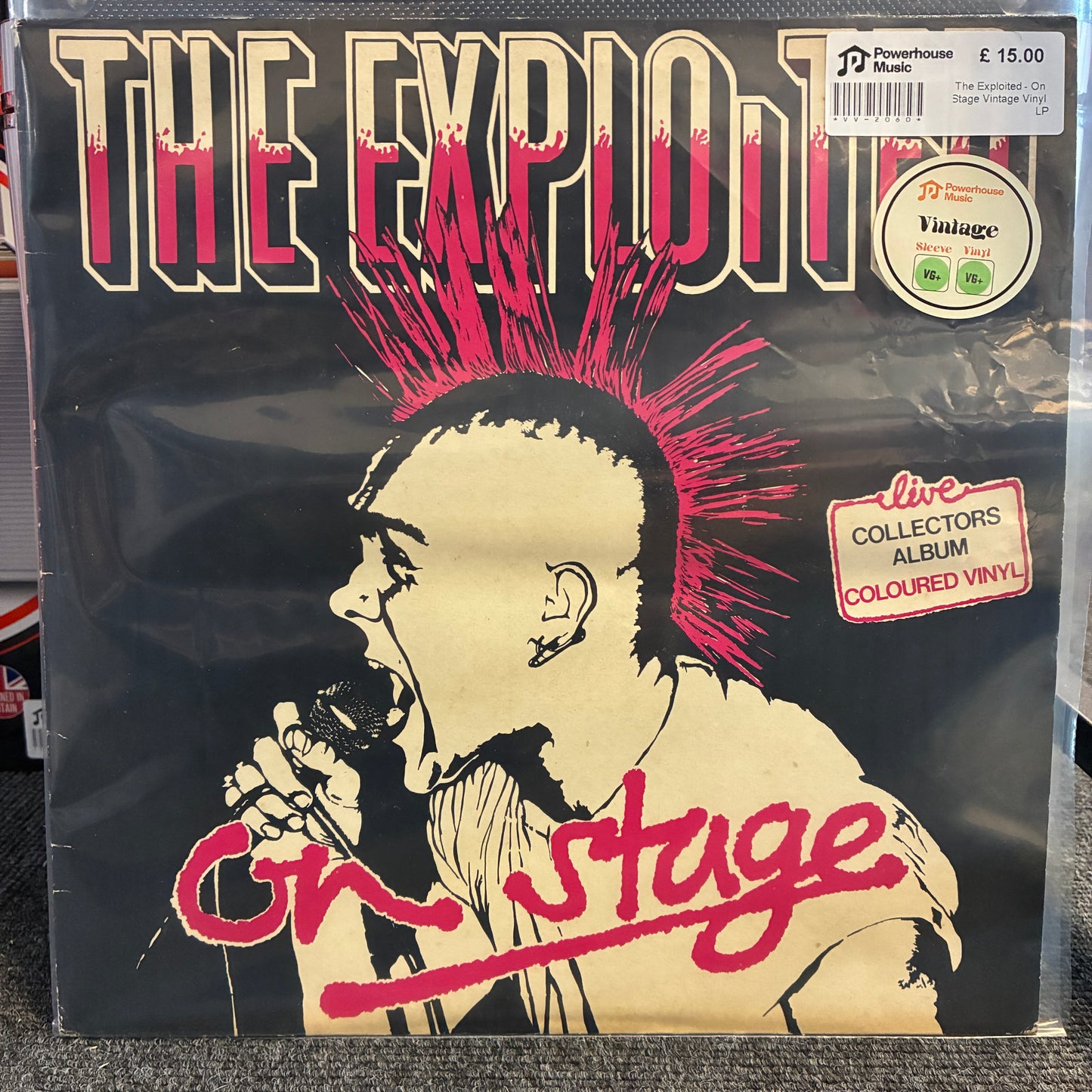 The Exploited - On Stage Vintage Vinyl LP The Exploited 'On Stage' live collectors album vinyl record in its shrink wrap, featuring a black, beige, and red graphic design with a mohawk illustration.