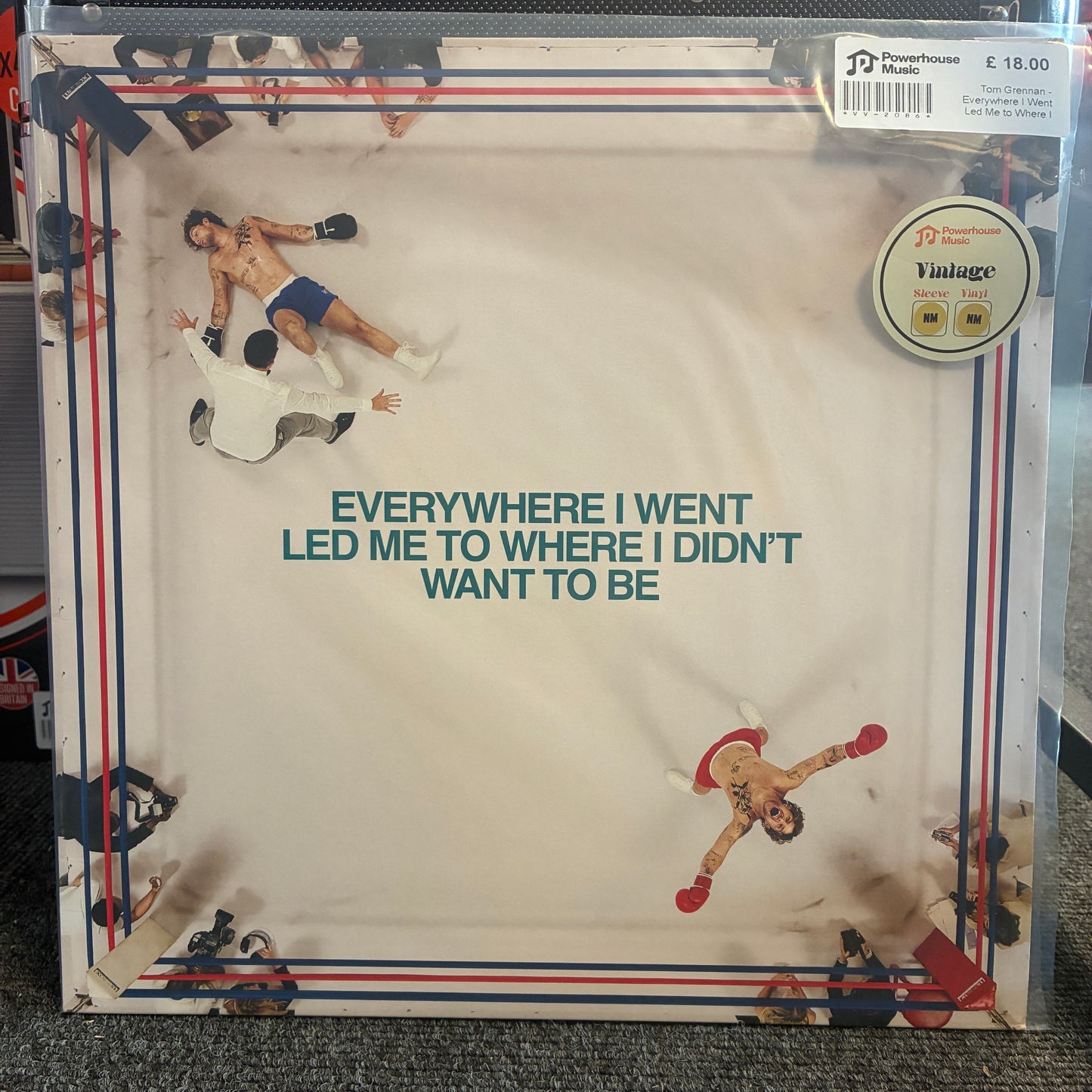 Tom Grennan - Everywhere I Went Led Me to Where I Didnt Want to Be Vintage Vinyl LP The album 'Everywhere I Went' by The Powerhouse Music, presented in its original clear vinyl record sleeve with printed boxing illustrations and a round 'Vintage' sticker on the top right.