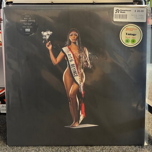 Beyonce - Cowboy Carter (Limited Edition Blue Cowboy Hat Cover) Vintage Vinyl LP A vinyl record sleeve for 'Get Is Cowboy Carter' on the Repeater label, featuring a glossy black cover with a central image of a woman in a white bodysuit and sash reading 'MISS BERMUDA'. A round 'Vintage' sticker is visible in the top right corner.