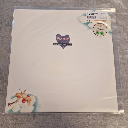 Erasure - Who Needs Love Like That Vintage Vinyl 12" Single A vinyl record sleeve for Erasure's 'All Around Love' 12-inch release, sealed in a clear plastic protective case. The sleeve features a clean white background with a purple heart-shaped logo in the center and cherub illustrations in the bottom-left corner.