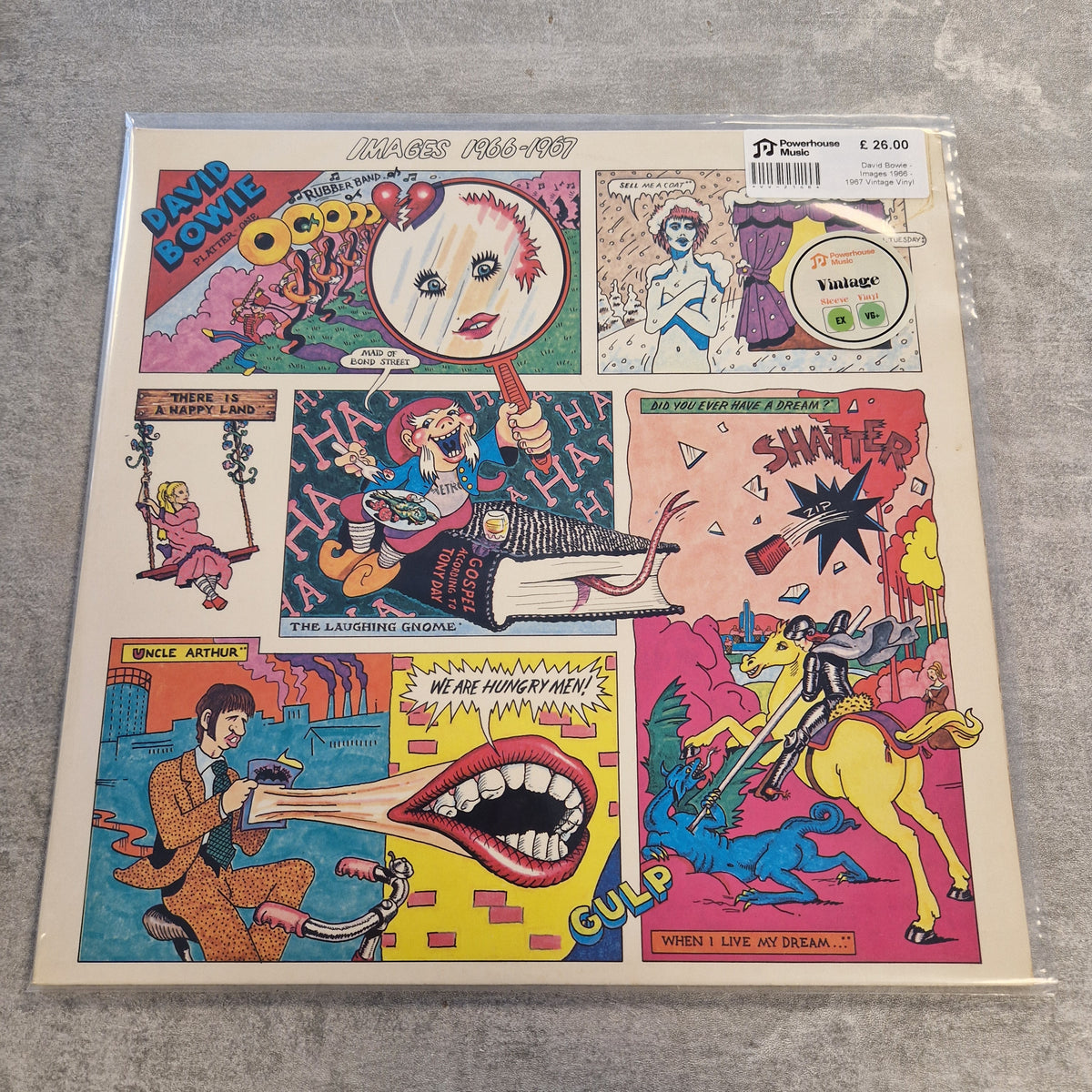 David Bowie - Images 1966 - 1967 Vintage Vinyl LP A vinyl record sleeve for David Bowie's 'Hears 101.1' album, featuring a colorful collage of comic-style illustrations on a light beige background, photographed flat on a gray textured surface.