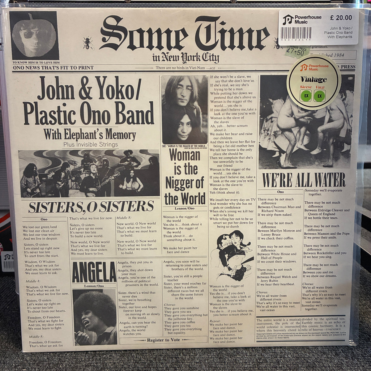 John & Yoko / Plastic Ono Band With Elephants Memory And Invisible Strings - Some Time In New York City Vintage Vinyl LP A vinyl record sleeve featuring a vintage newspaper front page design with music headlines and text, photographed in a clear plastic sleeve on a carpeted floor.