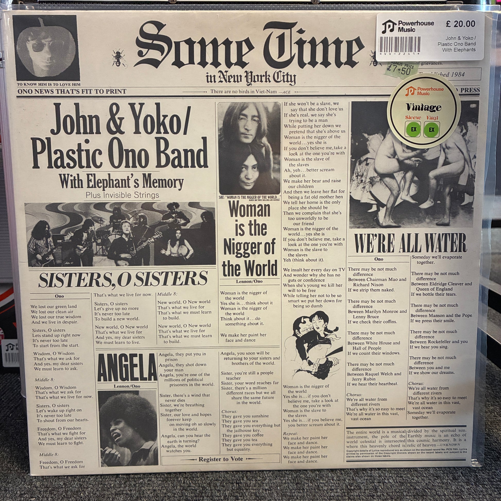 John & Yoko / Plastic Ono Band With Elephants Memory And Invisible Strings - Some Time In New York City Vintage Vinyl LP A vinyl record sleeve featuring a vintage newspaper front page design with music headlines and text, photographed in a clear plastic sleeve on a carpeted floor.