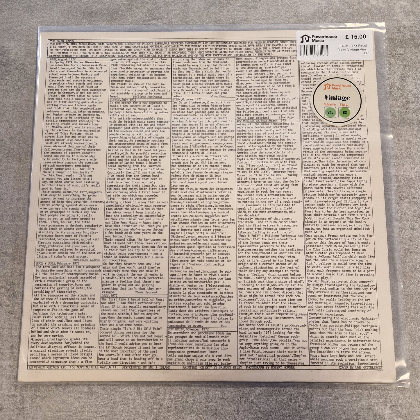 Faust - The Faust Tapes Vintage Vinyl LP A vinyl record sleeve photographed from the back, sealed in a clear plastic protective bag. The sleeve features dense columns of small black text on an off-white background, with a circular sticker reading 'Vintage' and a barcode at the top right.