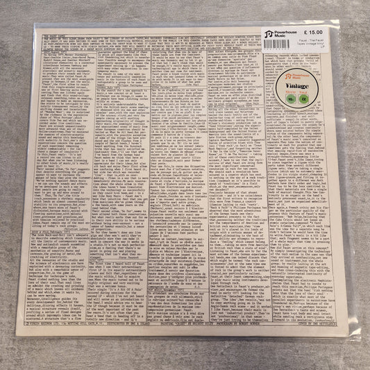 Faust - The Faust Tapes Vintage Vinyl LP A vinyl record sleeve photographed from the back, sealed in a clear plastic protective bag. The sleeve features dense columns of small black text on an off-white background, with a circular sticker reading 'Vintage' and a barcode at the top right.