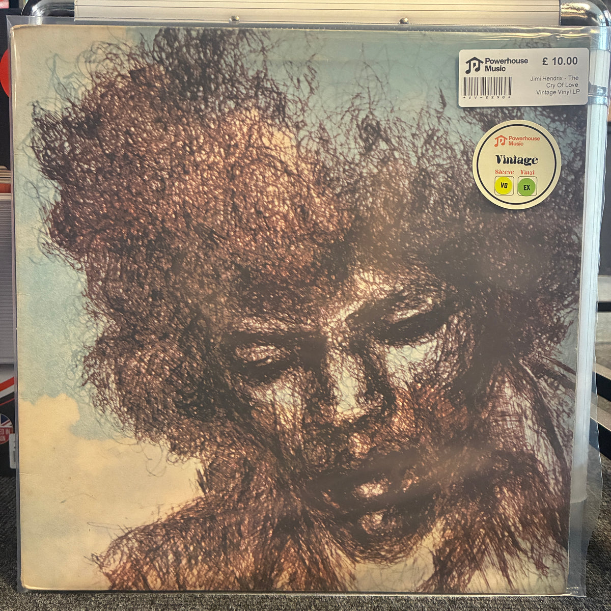 Jimi Hendrix - The Cry Of Love Vintage Vinyl LP A vinyl record sleeve for John Lennon's 'The John Lennon Album' on a clear plastic protective case, with a 'Pioneer Studio' sticker and a 'Vintage' sticker visible on the cover.