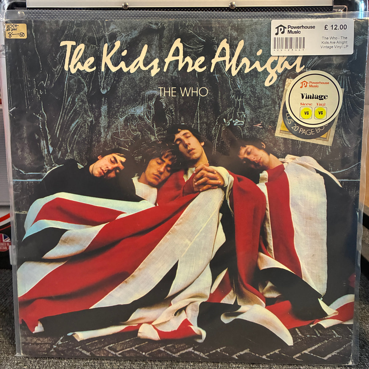 The Who - The Kids Are Alright Vintage Vinyl LP The Who - The Kids Are Alright vinyl record album cover, showing the band members wrapped in a Union Jack flag. The album is housed in a clear plastic protective sleeve, with a Powerhouse Music sticker and barcode visible in the top right corner.