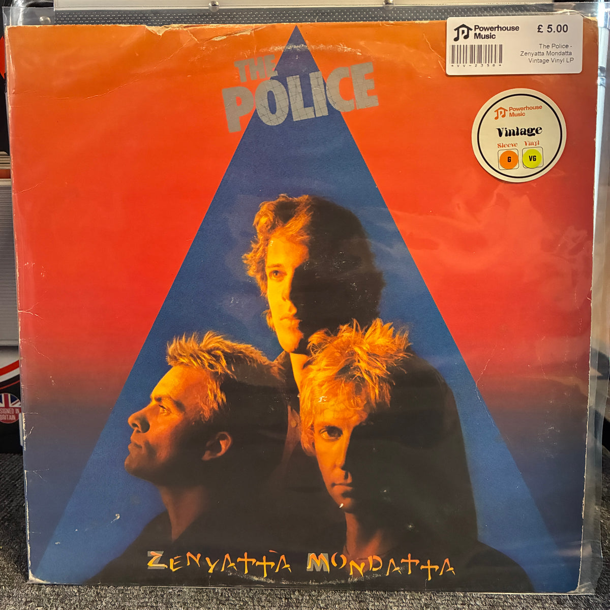 The Police - Zenyatta Mondatta Vintage Vinyl LP The Police 'Zenyatja Mondatja' vinyl record LP cover, showing the band members' faces integrated into a red and blue triangle design. A JD Powerhouse Music sticker is visible in the top right corner.