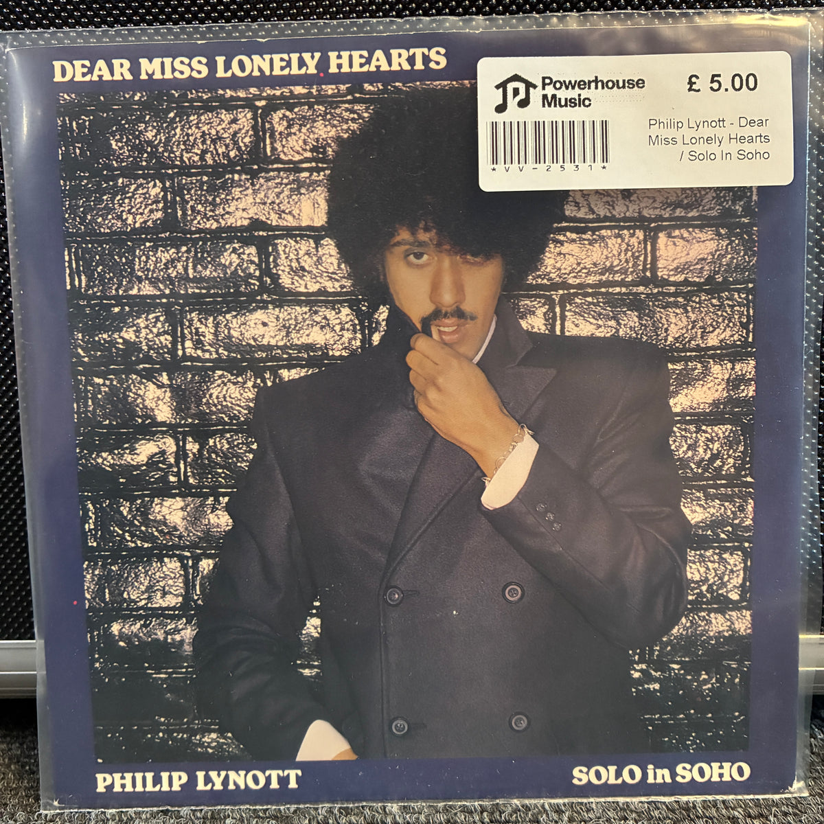 Philip Lynott - Dear Miss Lonely Hearts / Solo In Soho Vintage Vinyl 7" Single Vinyl record sleeve for Philip Lynott's 'Dear Miss Lonely Hearts' / 'Solo in Soho' on Powerhouse Music, featuring a portrait of the artist against a brick wall.