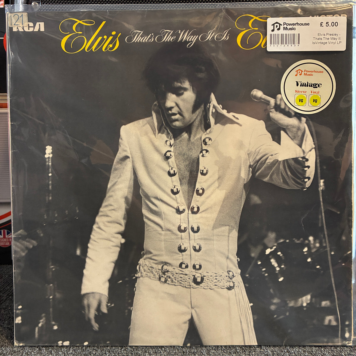 Elvis Presley - That's The Way It Is Vintage Vinyl LP Elvis 'That's The Way It Is' vinyl record album cover, showing Elvis in a light-colored embellished jacket holding a microphone. RCA and Powerhouse logos are visible, with a Price Tag sticker in the top right.