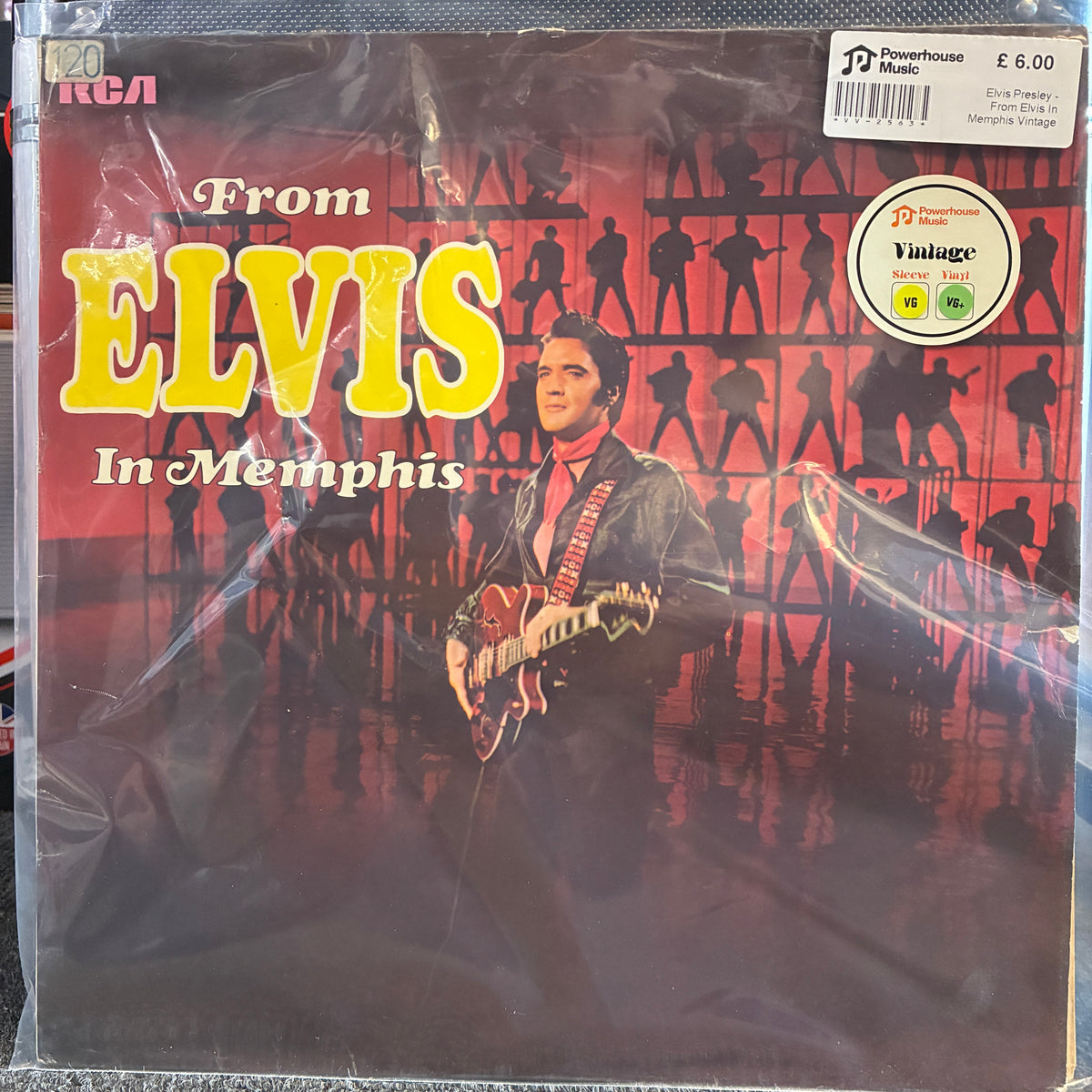 Elvis Presley - From Elvis In Memphis Vintage Vinyl LP  Elvis 'From Memphis' vinyl record album cover, sealed in clear plastic shrink wrap. The cover features a red background with black silhouettes of figures and a photo of Elvis holding an electric guitar.