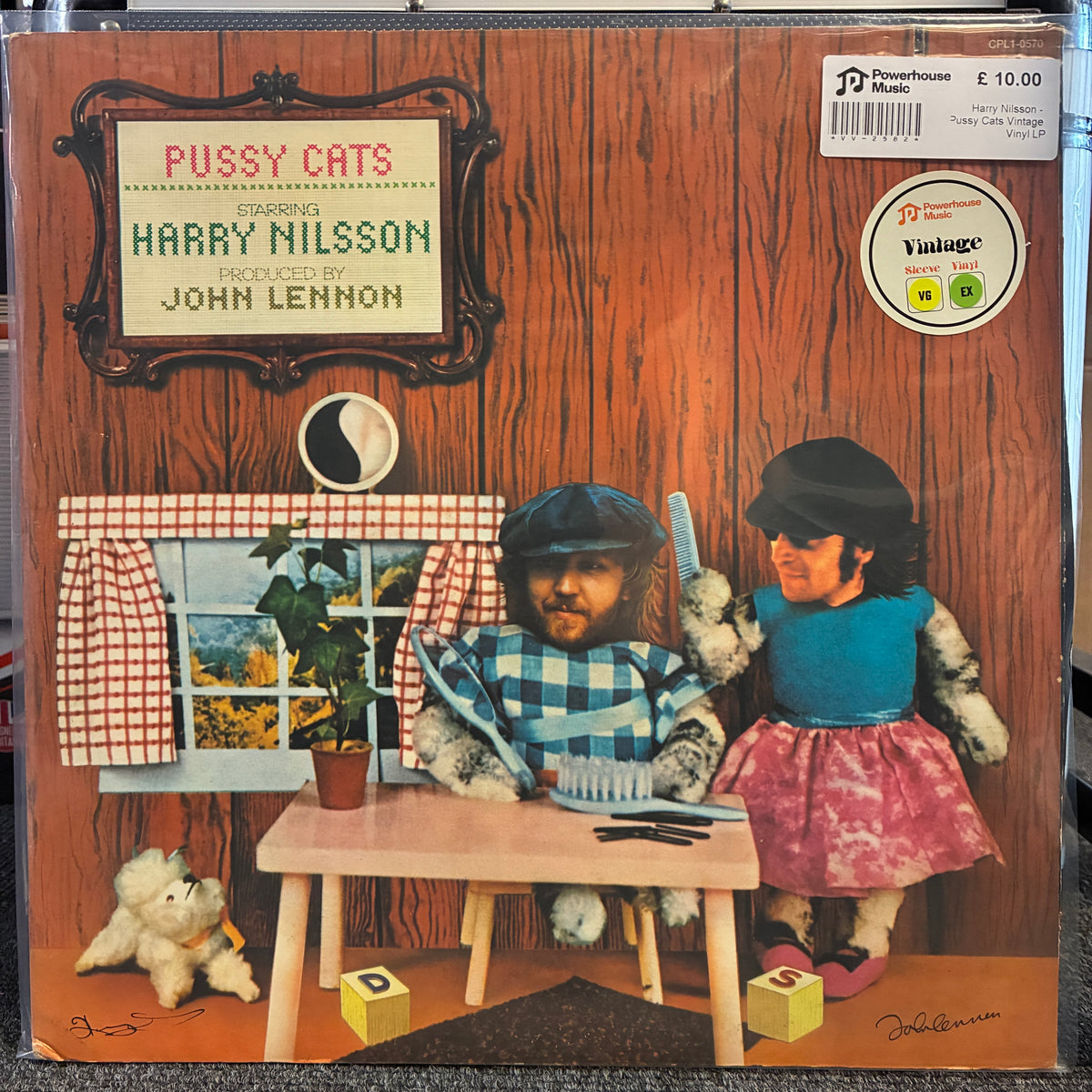 Harry Nilsson - Pussy Cats Vintage Vinyl LP Pussy Cats / Harry Nilsson / John Lennon vinyl record cover artwork, showing a wood-paneled background with illustrated figures, a small table, and a window. A barcode sticker and a circular 'Vintage' logo are visible on the cover.