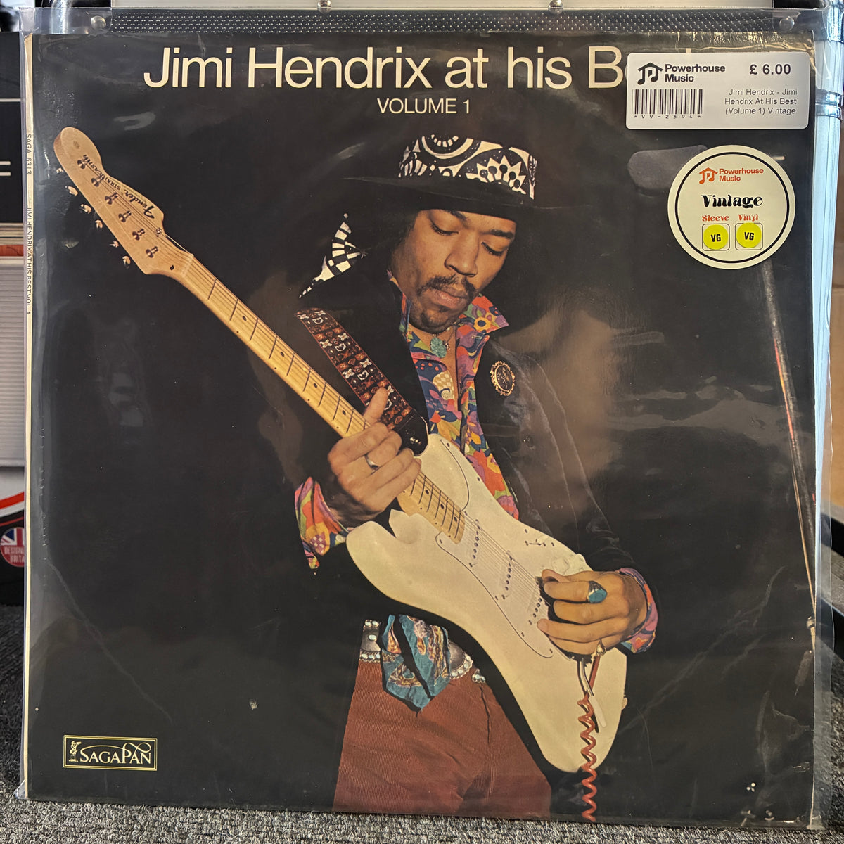 Jimi Hendrix - Jimi Hendrix At His Best (Volume 1) Vintage Vinyl LP Jimi Hendrix 'at his B' Volume 1 vinyl record album cover by Sagapan, featuring a photo of Jimi playing an electric guitar against a dark background.