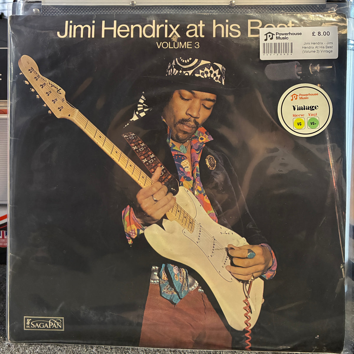 Jimi Hendrix - Jimi Hendrix At His Best (Volume 3) Vintage Vinyl LP Jimi Hendrix 'at his Best Volume 3' vinyl record cover, sealed in a clear plastic sleeve. The cover art features a dark background with a portrait of Jimi Hendrix playing a white electric guitar, wearing a patterned bandana and colorful shirt.