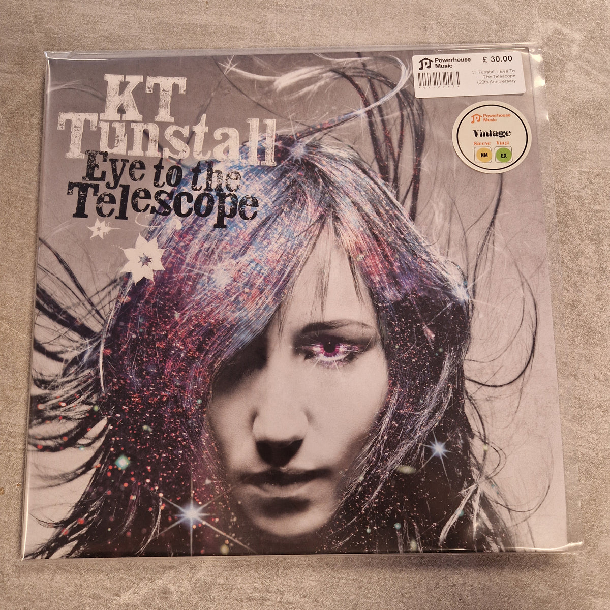 KT Tunstall - Eye To The Telescope (20th Anniversary Stargazer Edition Pink & Blue) Vintage Vinyl LP KT Twiztid's 'Live to the Telescope' vinyl record album cover, sealed in its original plastic shrink wrap and showing a Vintage logo sticker in the top left corner, placed on a gray textured surface.