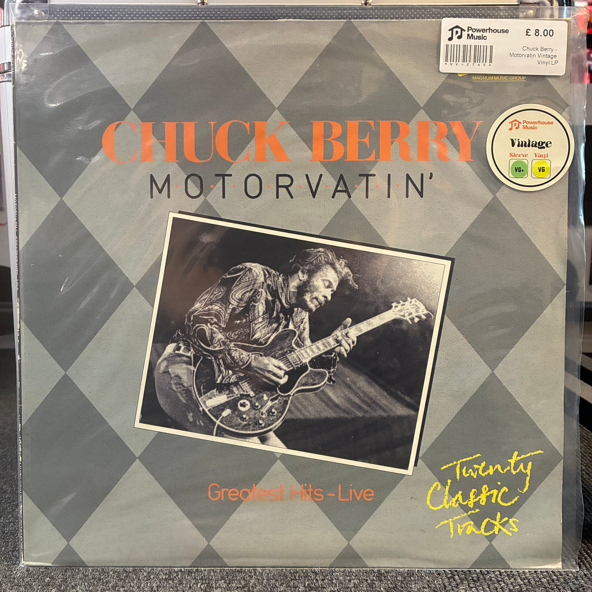 Chuck Berry - Motorvatin' Vintage Vinyl LP Chuck Berry 'Motorvatin'' vinyl record album cover, sealed in plastic shrink wrap. The cover features a gray and black diamond pattern, an orange title, a black-and-white photo of Chuck Berry playing guitar, and a 'Vintage' label sticker on the top right.