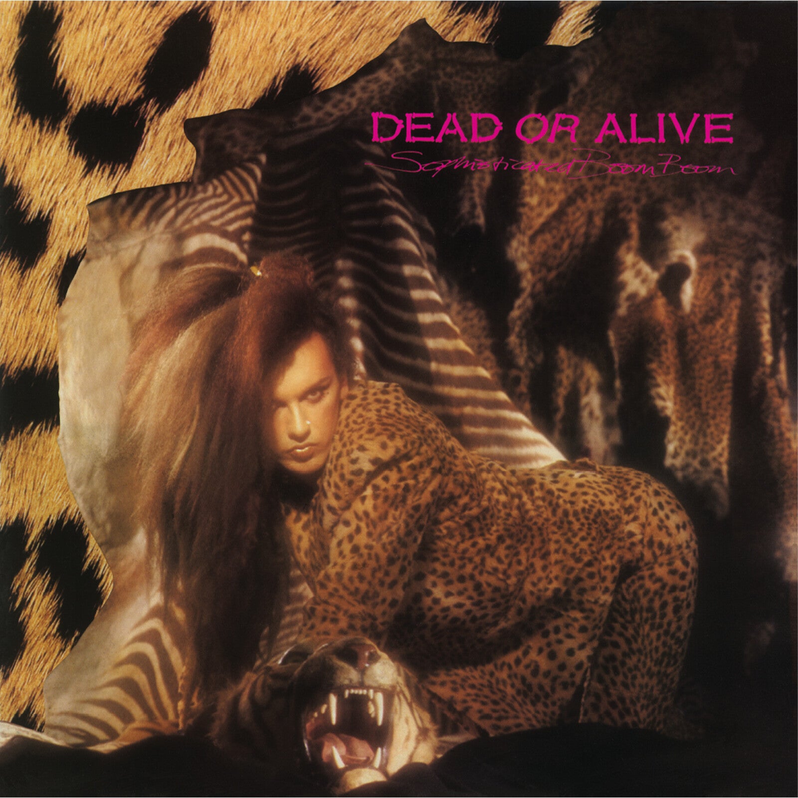 Dead Or Alive - Sophisticated Boom Boom Album cover with a person in a leopard print outfit surrounded by animals, featuring the text 'Dead or Alive'.