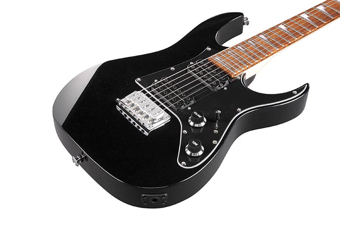 Ibanez GRGM21-BKN Black electric guitar with a white pickguard on a white background