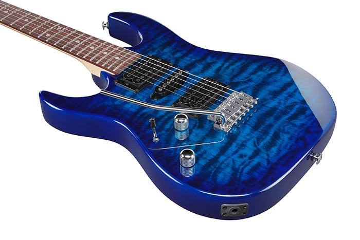 Blue electric guitar on a white background