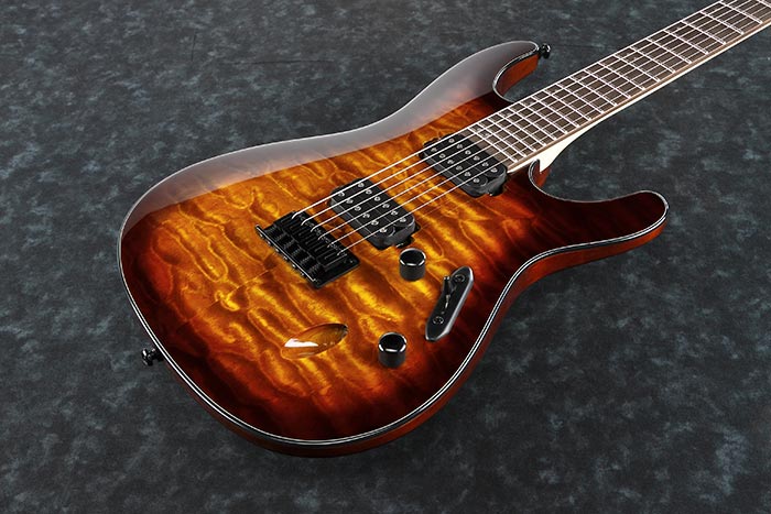 Ibanez S621QM-DEB Electric guitar with a sunburst finish on a dark textured background