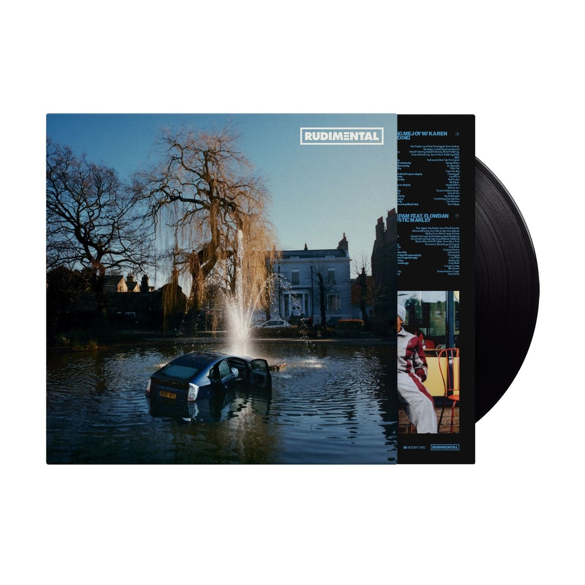 Rudimental - RUDIM3NTAL Vinyl record with a scenic cover featuring a fountain and building.
