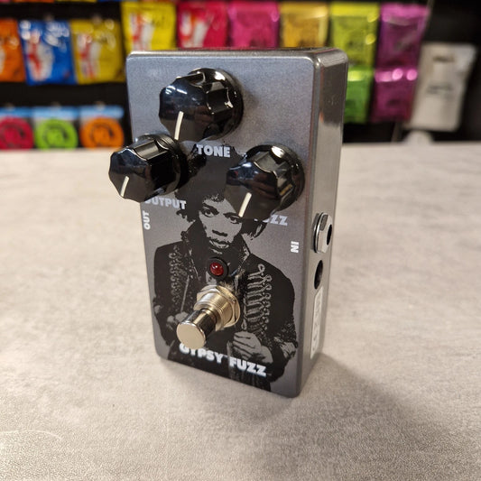 Pre-Owned Dunlop JHM8 Guitar effects pedal with a musician graphic on a neutral background