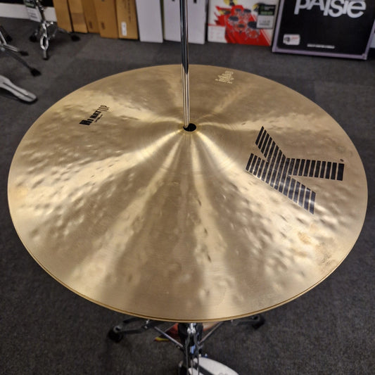 Pre-Owned Zildjian Cymbal on a stand in a room with boxes and equipment in the background