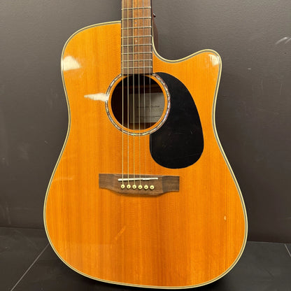Pre-Owned Takamine EG530SC Acoustic guitar with a sunburst finish on a dark background