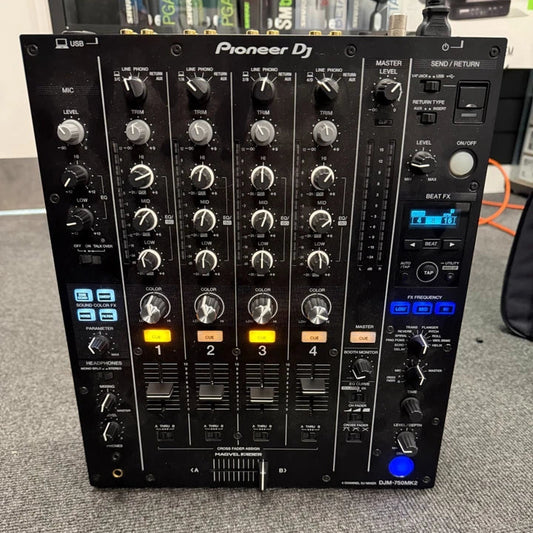 Pre-Owned Pioneer DJM-750MK2 Pioneer DJ mixer on a gray surface with a blurred background