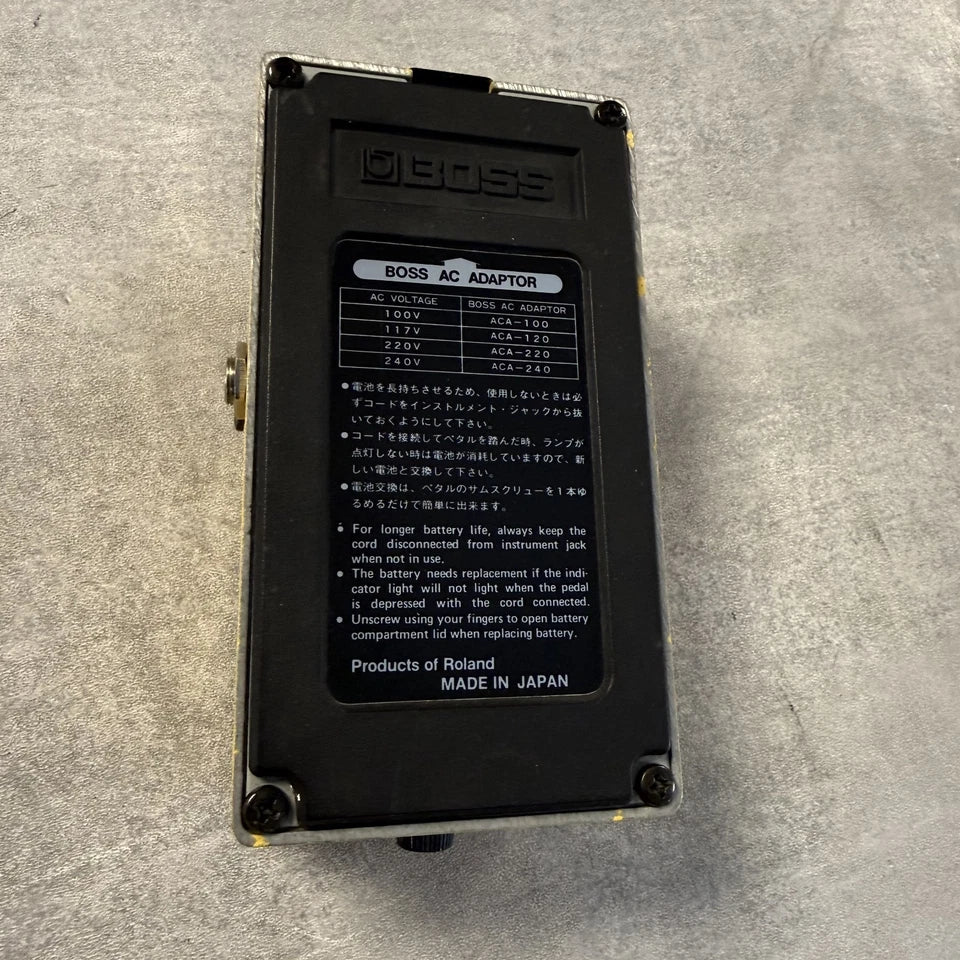 Pre-Owned Boss OD-1 Black BOSS AC adapter on a gray surface