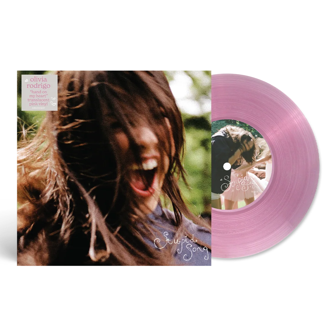 Olivia Rodrigo - Stupid Song (Translucent Pink) Vinyl 7" Single Pink translucent vinyl record partially pulled from its album sleeve, shown on a clean white background. The sleeve features a close-up portrait of a smiling woman with long brown hair, and the record label center also shows a matching portrait.
