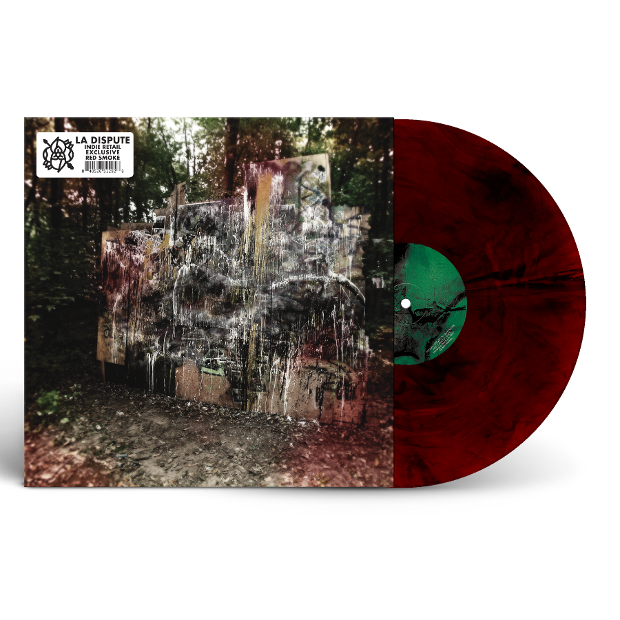 La Dispute - Wildlife (Red Smoke) Vinyl A vinyl record album shown on a white background, with the front cover featuring an abstract outdoor scene and the record partially pulled out, revealing a dark red marbled vinyl disc and a green center label.