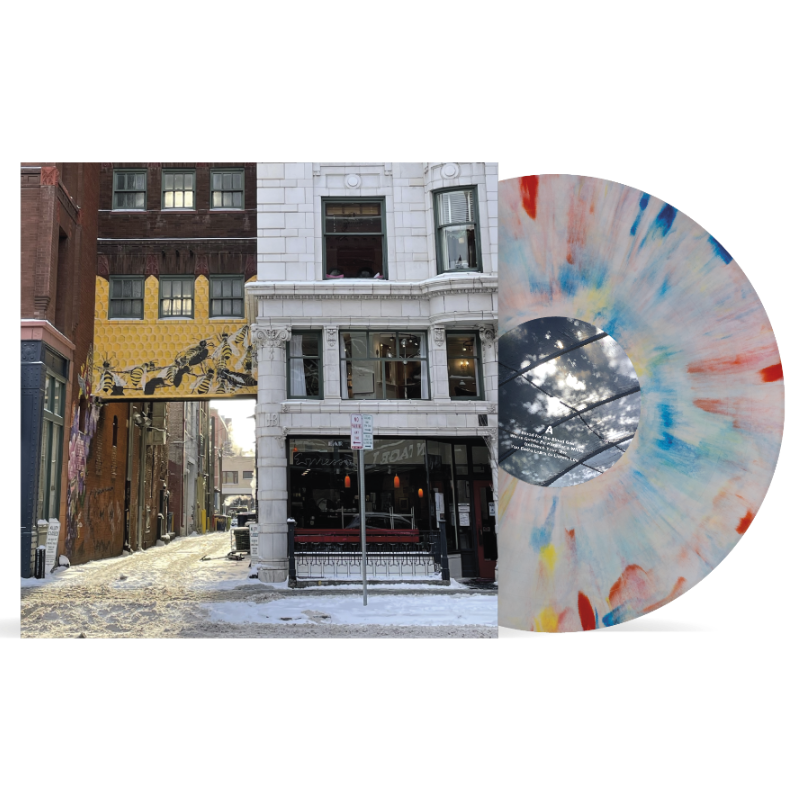 Ben Quad - I'm Scared That's All There Is (Crayons) Vinyl A vinyl record album shown on a white background, featuring a city street scene printed on the front cover and a translucent marbled record partially visible behind it.