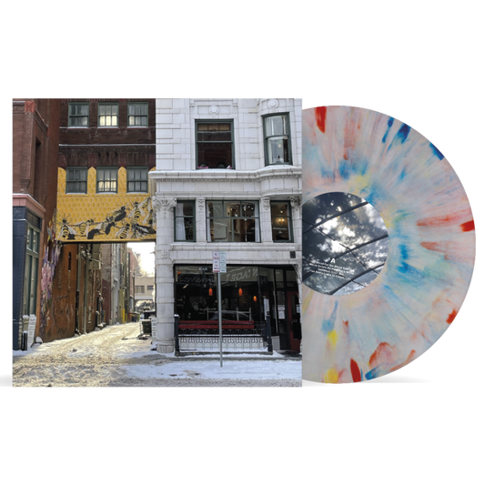 Ben Quad - I'm Scared That's All There Is (Crayons) Vinyl A vinyl record album shown on a white background, featuring a city street scene printed on the front cover and a translucent marbled record partially visible behind it.