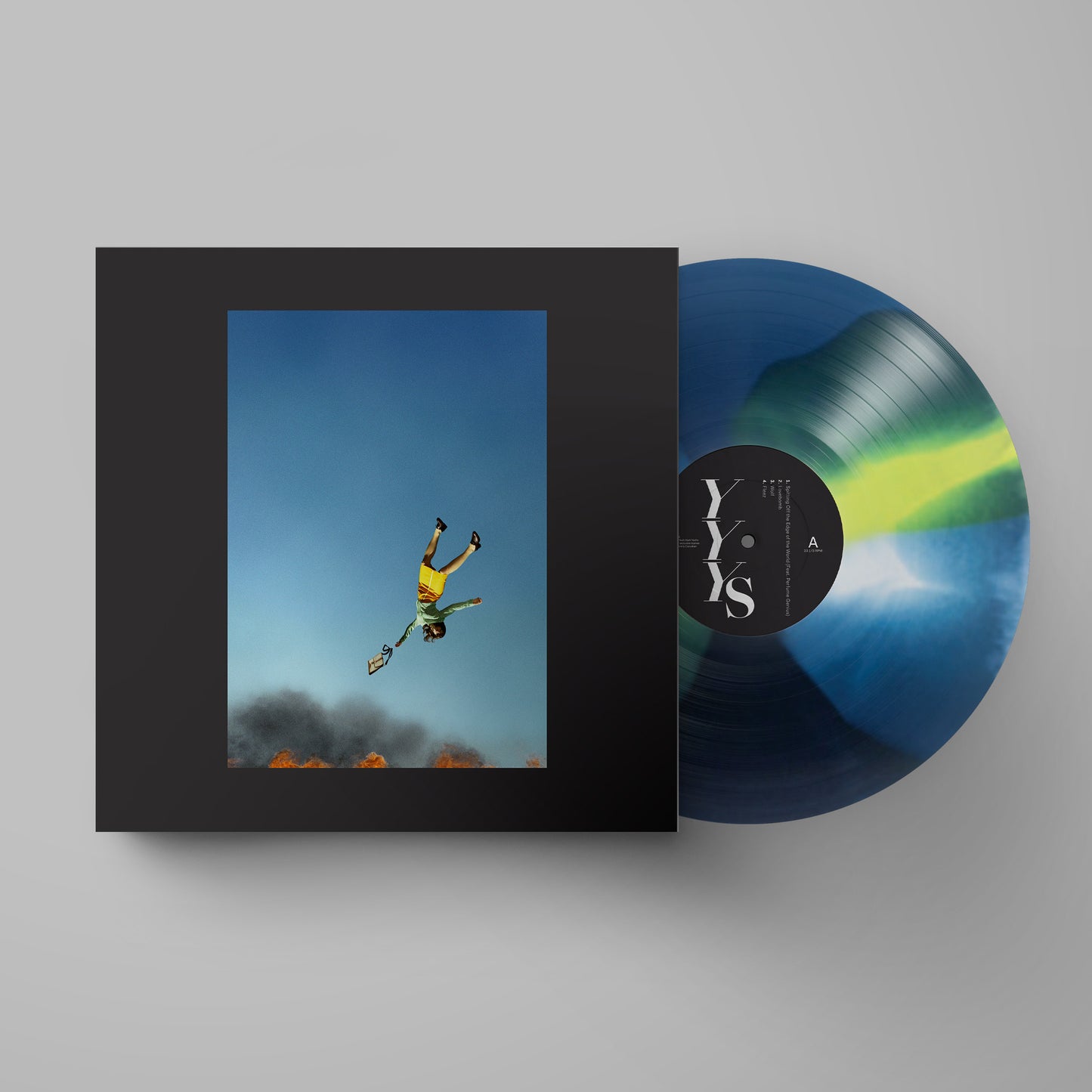 Yeah Yeah Yeahs - Cool It Down Vinyl record with colourful sleeve featuring a person in mid-air against a blue sky.